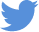 A blue bird silhouette flies with raised wings, representing the Twitter logo against a transparent background.